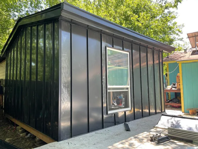 Black standing seam metal wall panels for Roof Inspection in North Plainfield