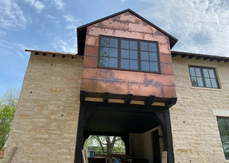 Copper metal panel facade on a stone building for Skylight Installation in North Plainfield